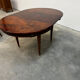 Extendable mahogany round table in Louis XVI style