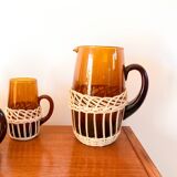 set of carafe and 6 cups in amber glass with wicker from the 70s