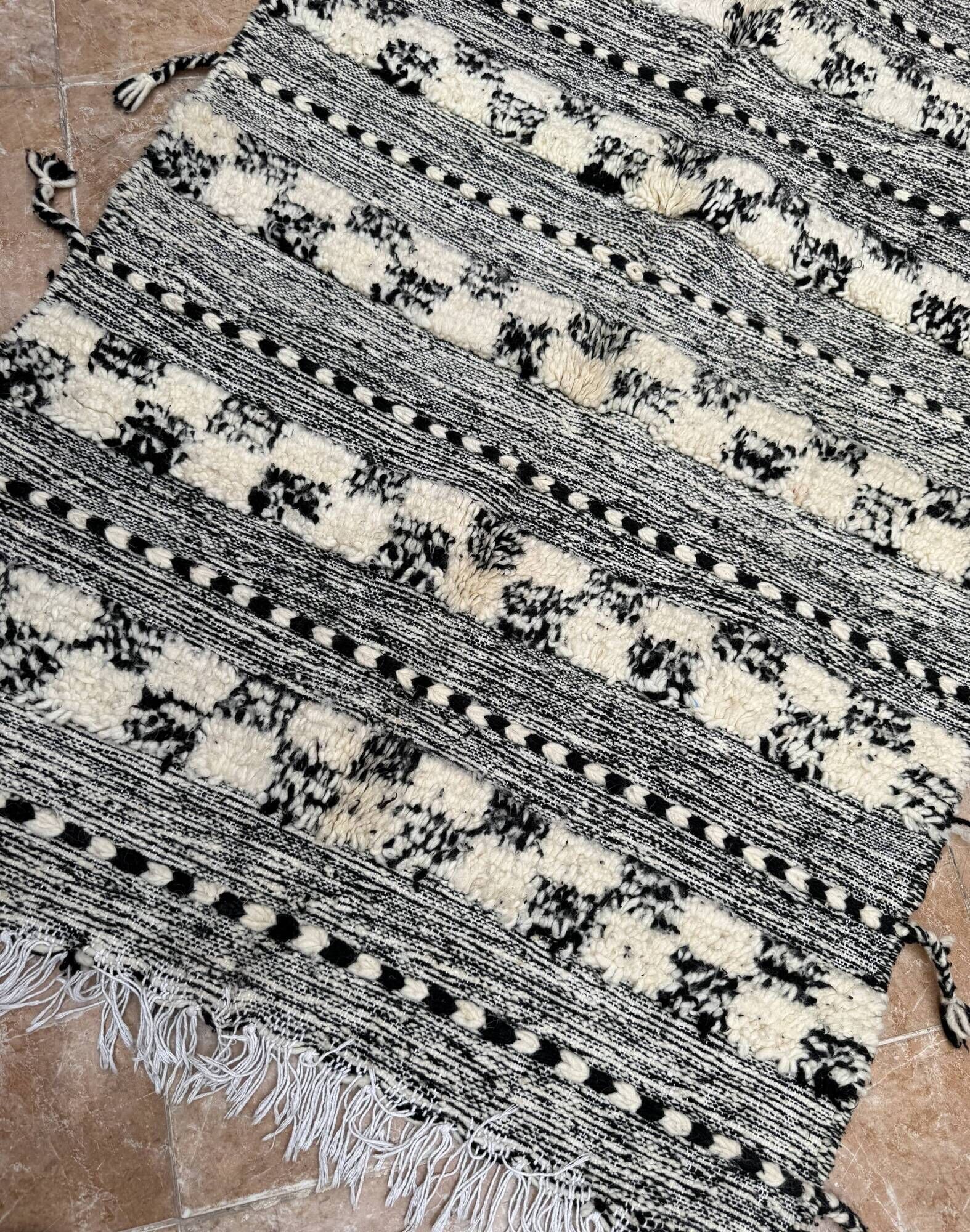 Small black Moroccan Berber Zanafi kilim rug for bedroom and living room.