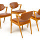 Four Kai Kristiansen oak chairs with new leather upholstery