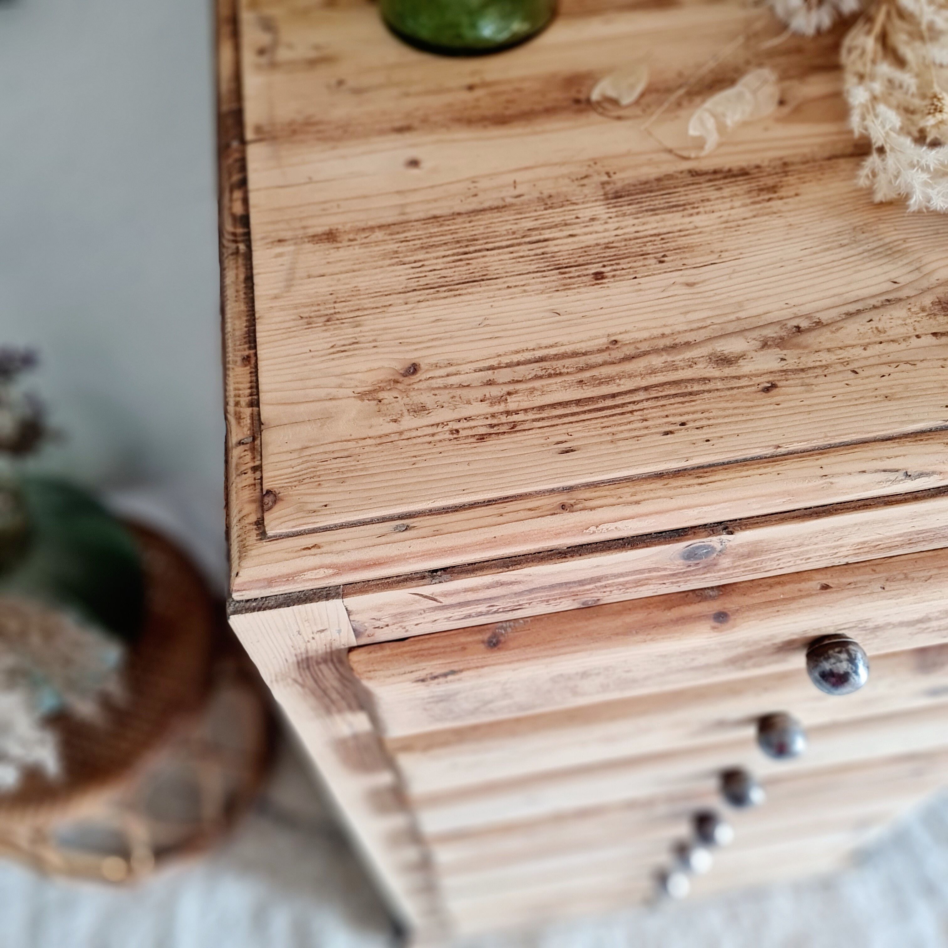 Old wooden chest of drawers raw and black wood
