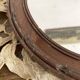Miroir ovale mercure en bois sculpté décor nœud ruban 37X52