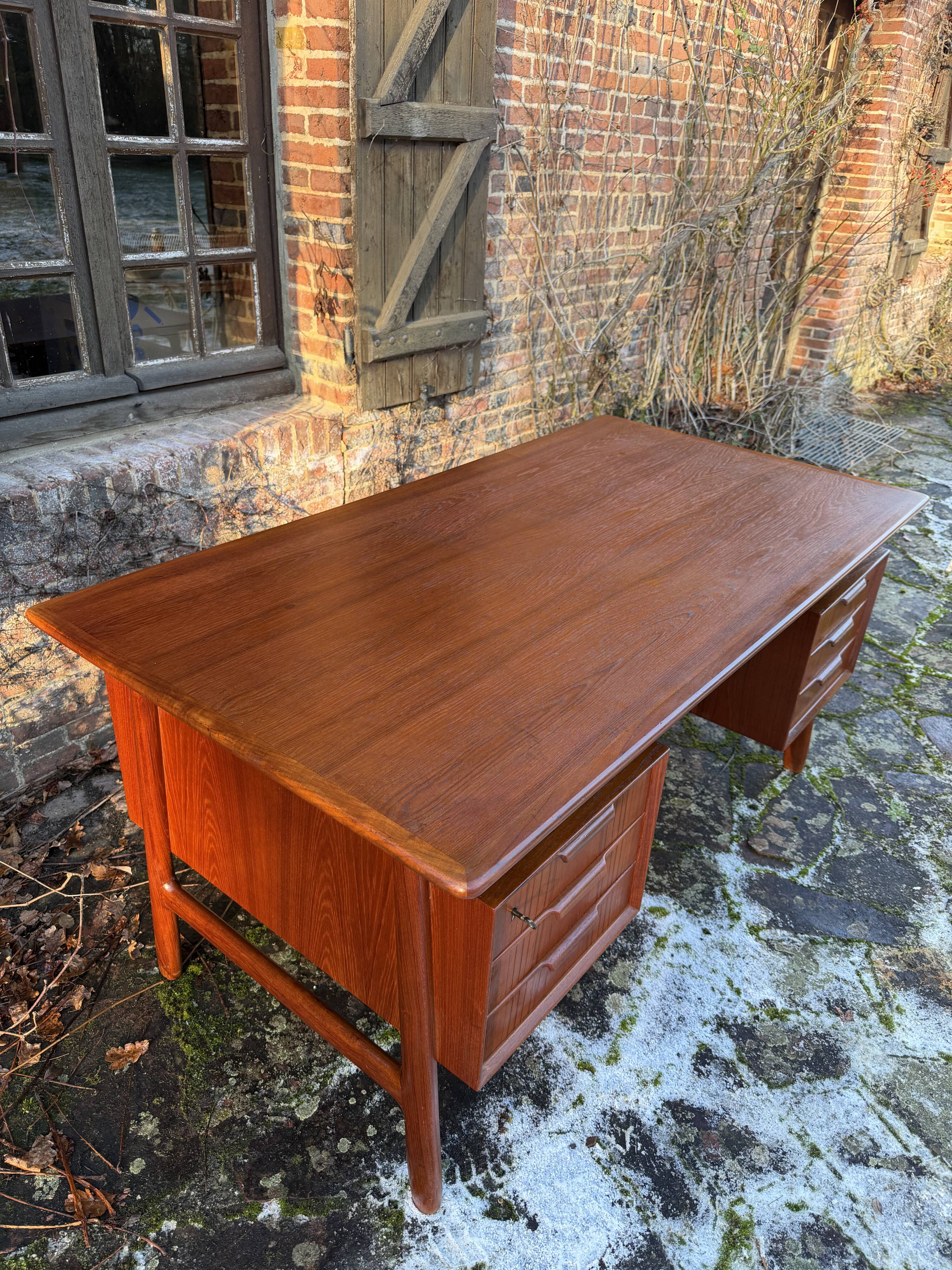 Danish teak desk Gunni Omann no. 75 from the 1960s.