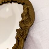 Gilded bronze mirror with angels and scrolls
