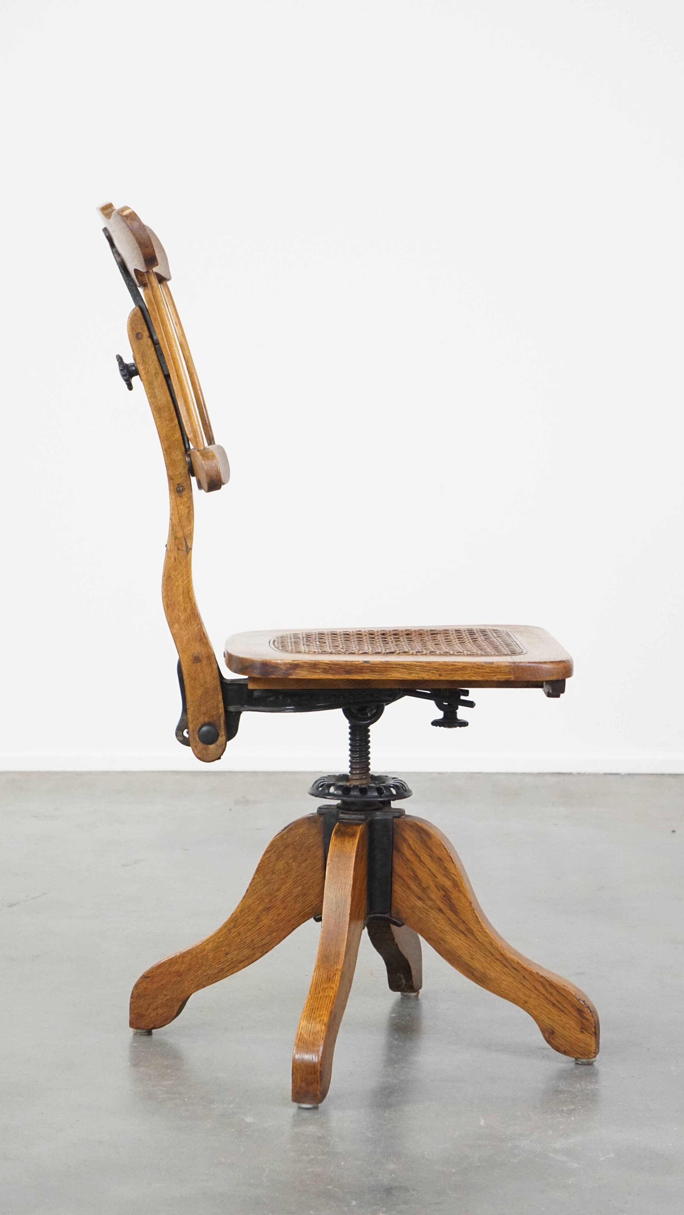 Antique late 19th century English office chair with reclining backrest and height adjustable