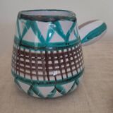 Coffee cup and small milk jug