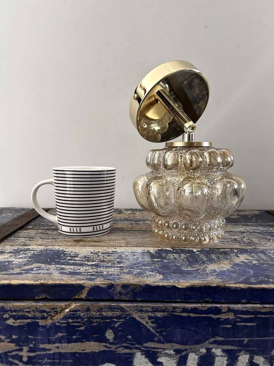 Gold tilting wall light