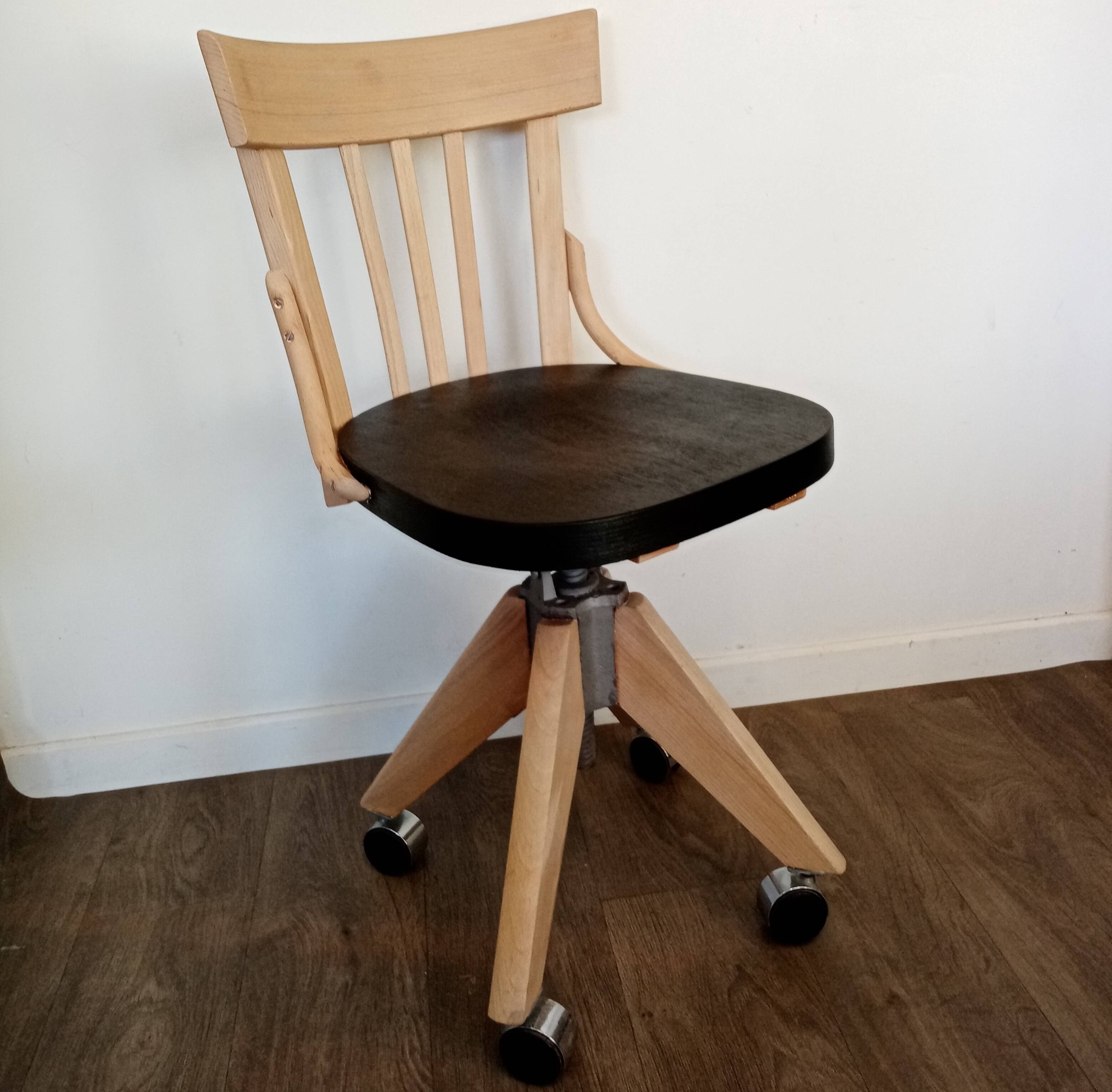 Black and wood workshop chair with metal base