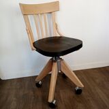 Black and wood workshop chair with metal base