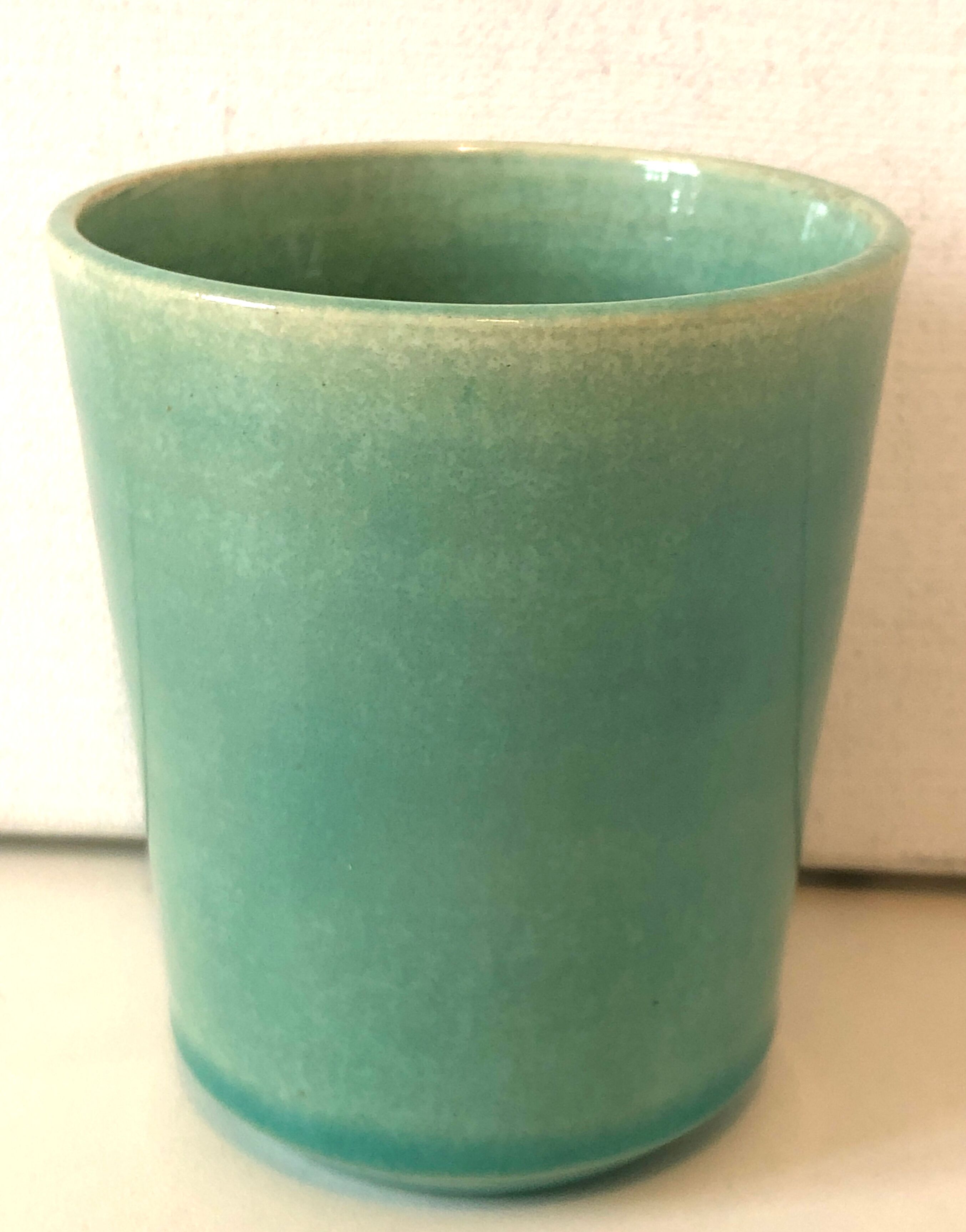Signed ceramic turquoise cup