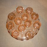 12 shot glasses on pink glass tray