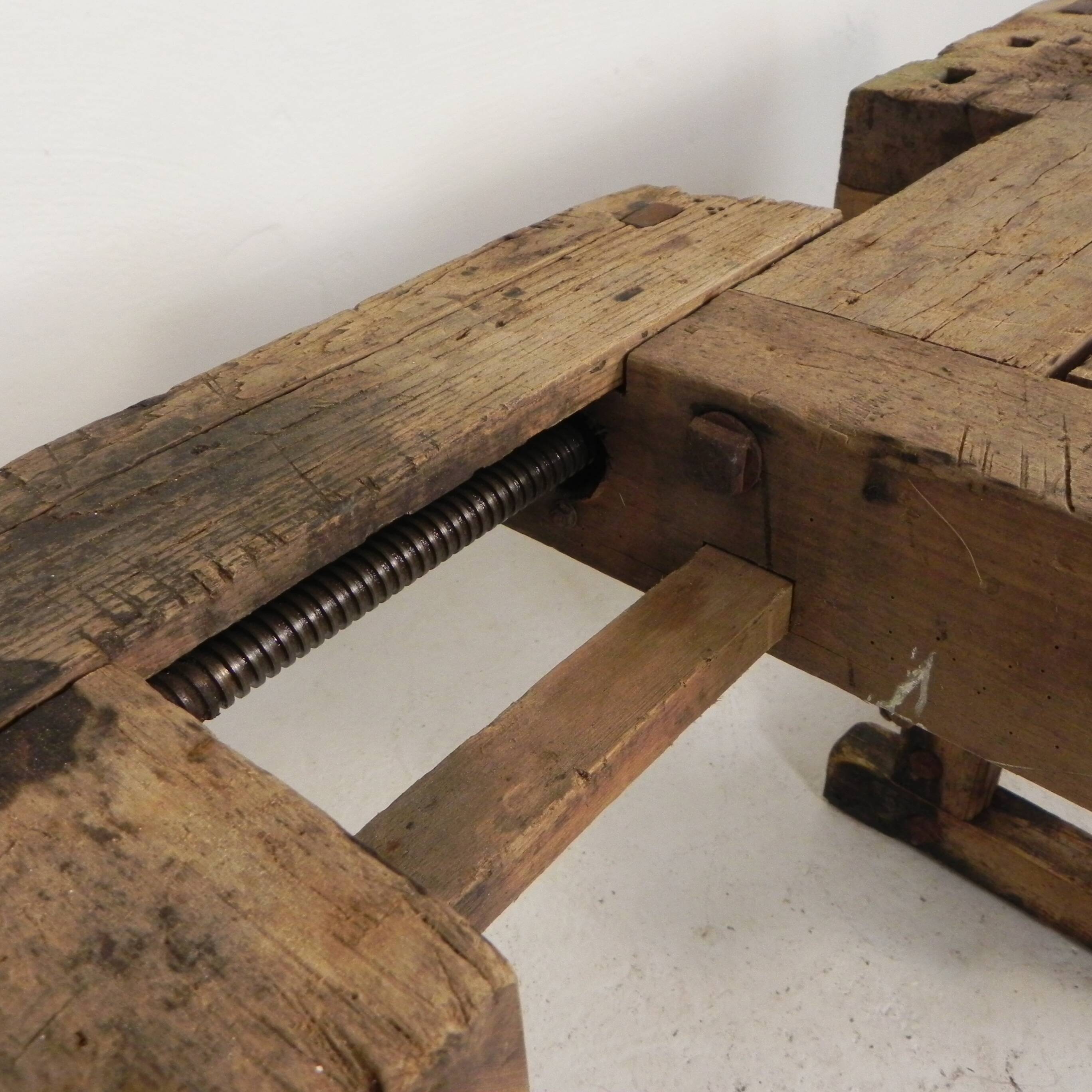 Wooden industrial workbench with vice, 194 cm long, 1930s.