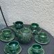 Service to the ceramic enamelled chiseled green and vintage