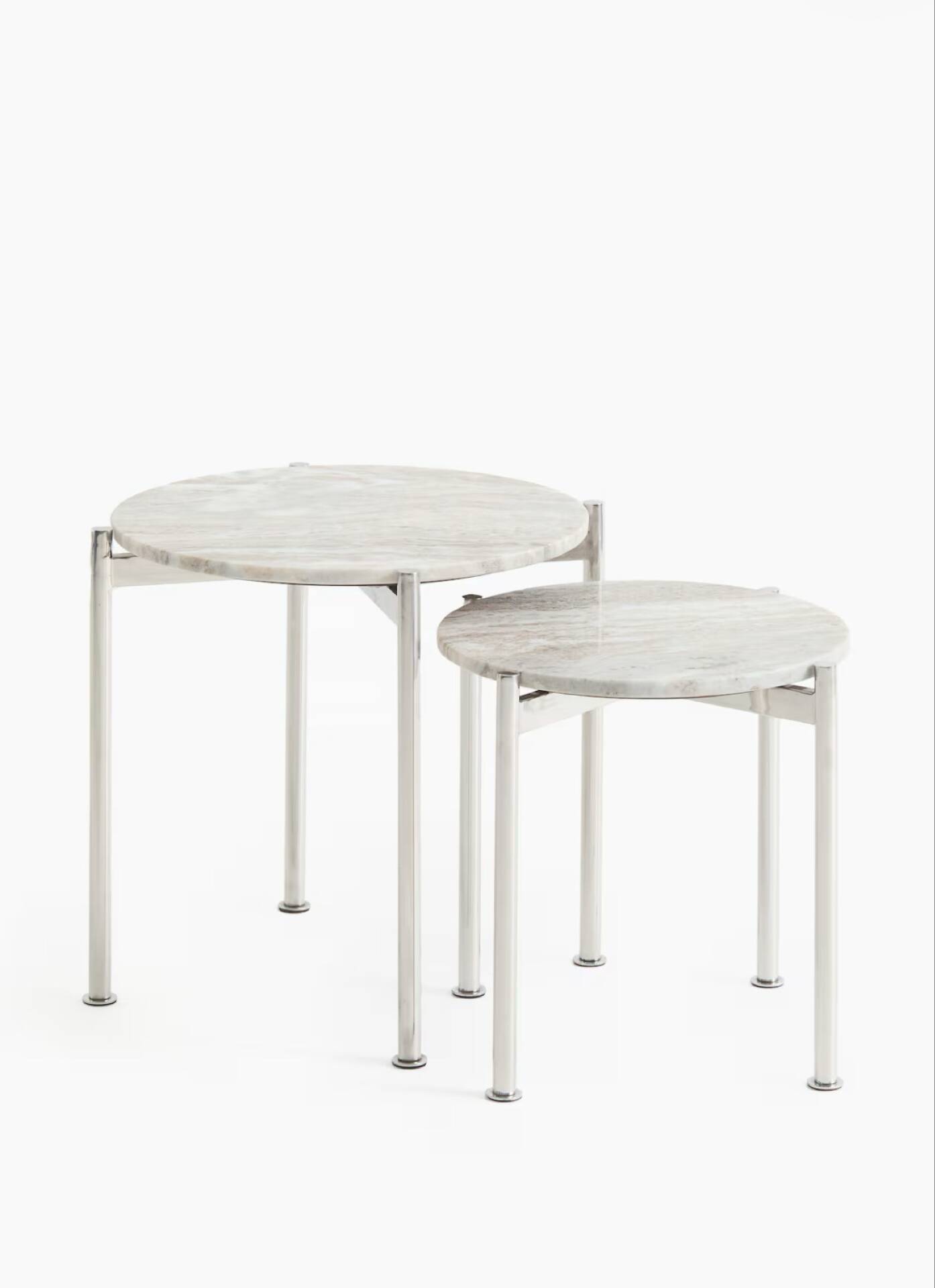 Round tables, side tables, coffee tables in marble and steel.