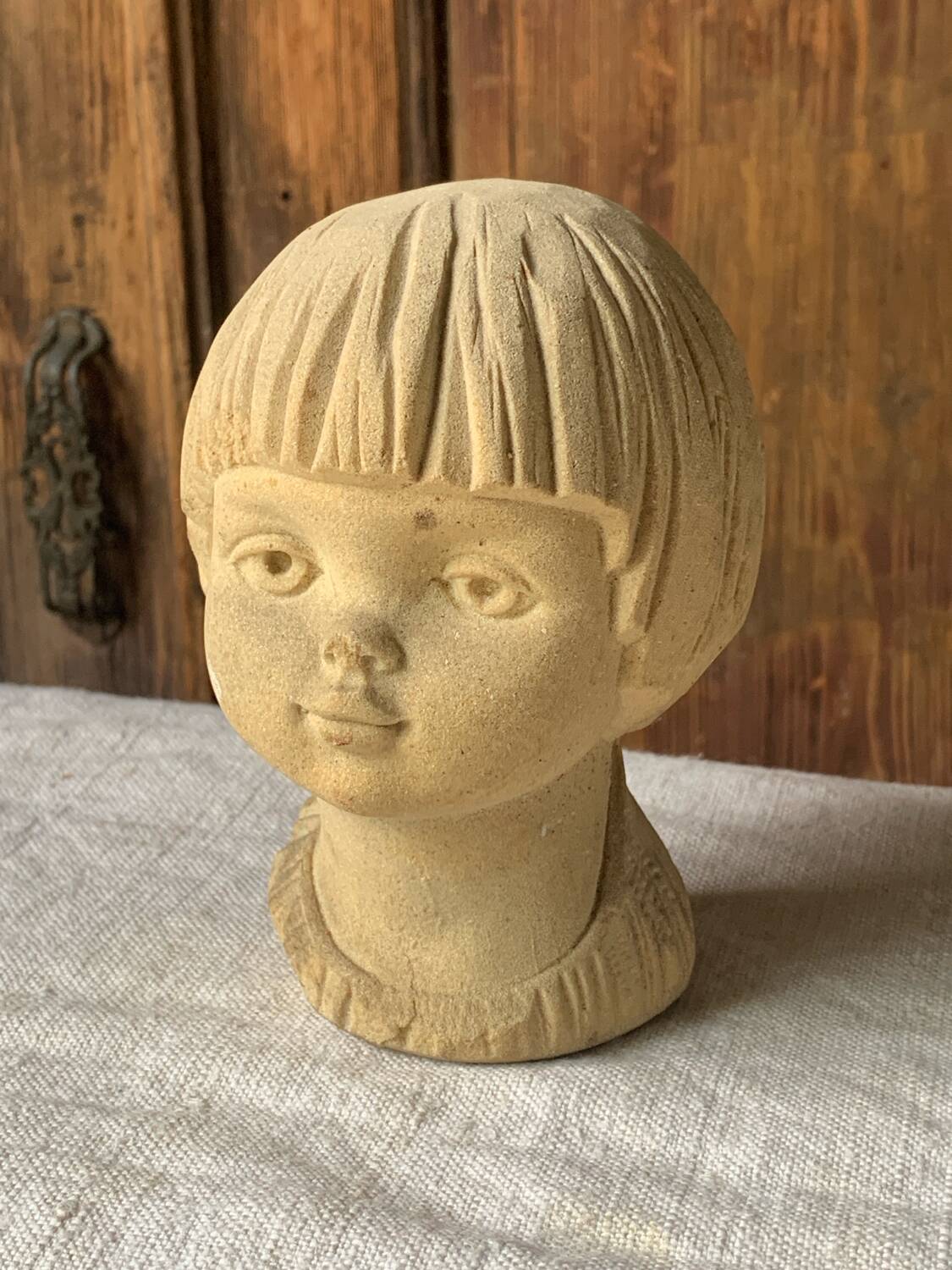 Stone bust of a little girl