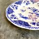 Round and hollow gien dish in white and blue enamelled earthenware