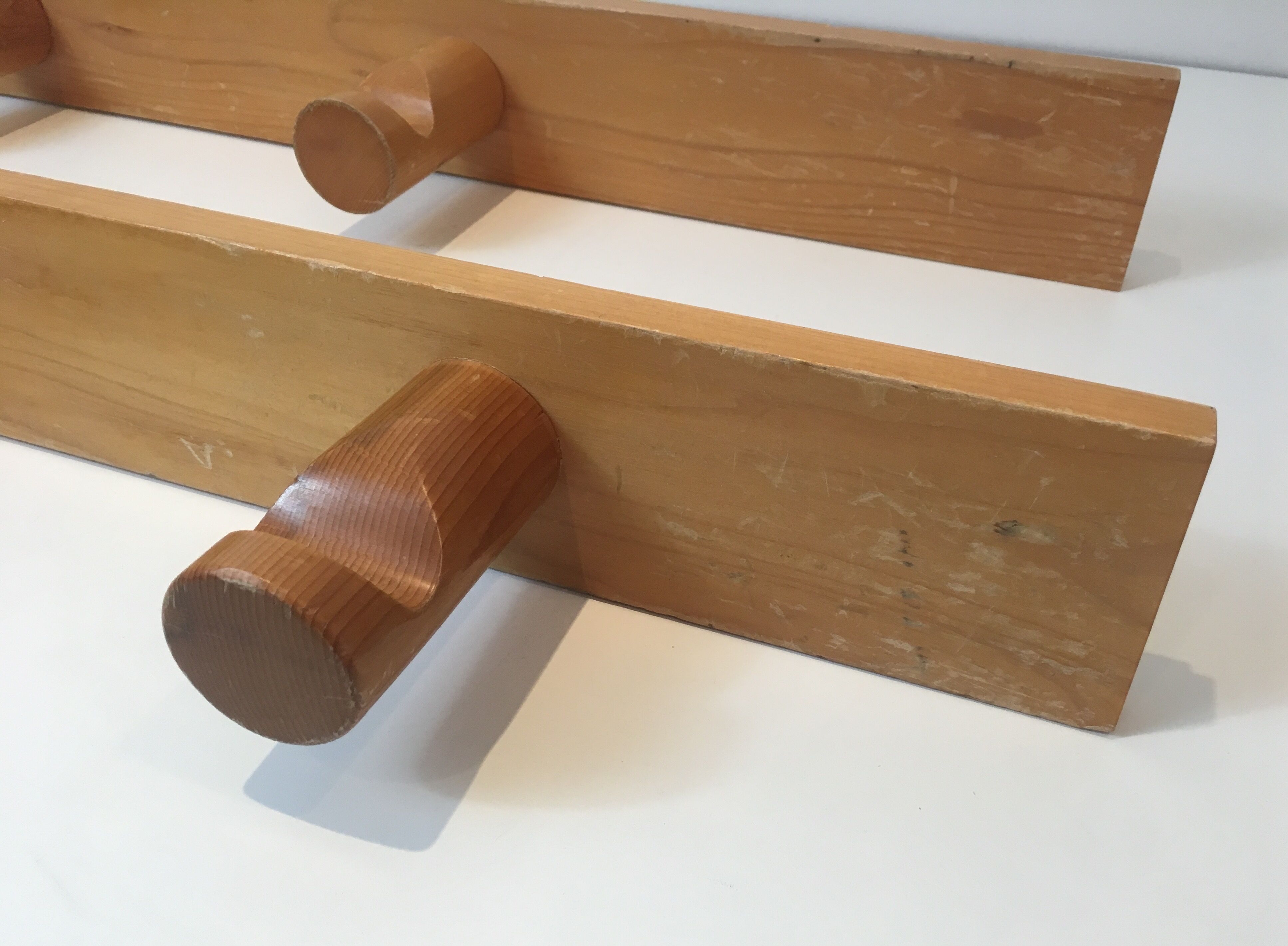 Charlotte Perriand, pair of fir wall coat racks, French work, around 1970