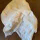 White cotton tablecloth with crochet lace.