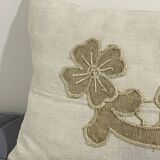 Cushion in vintage fabric with ornamentation