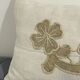 Cushion in vintage fabric with ornamentation.