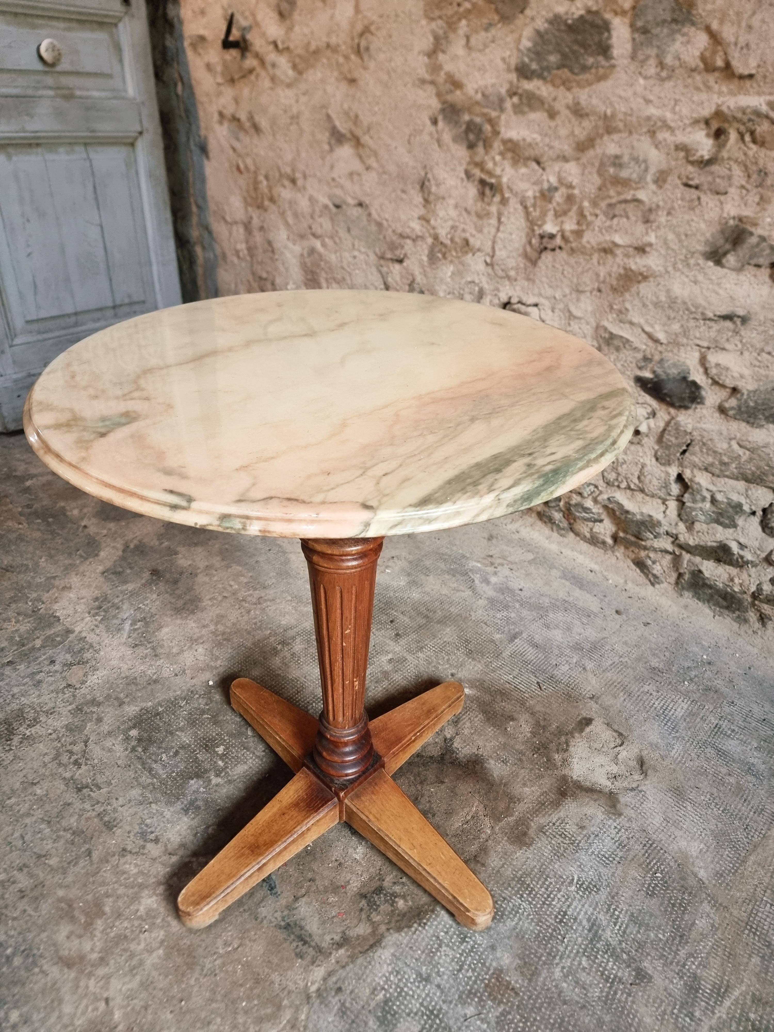 Vintage French bistro table in marble, walnut base, from 1920–1940.