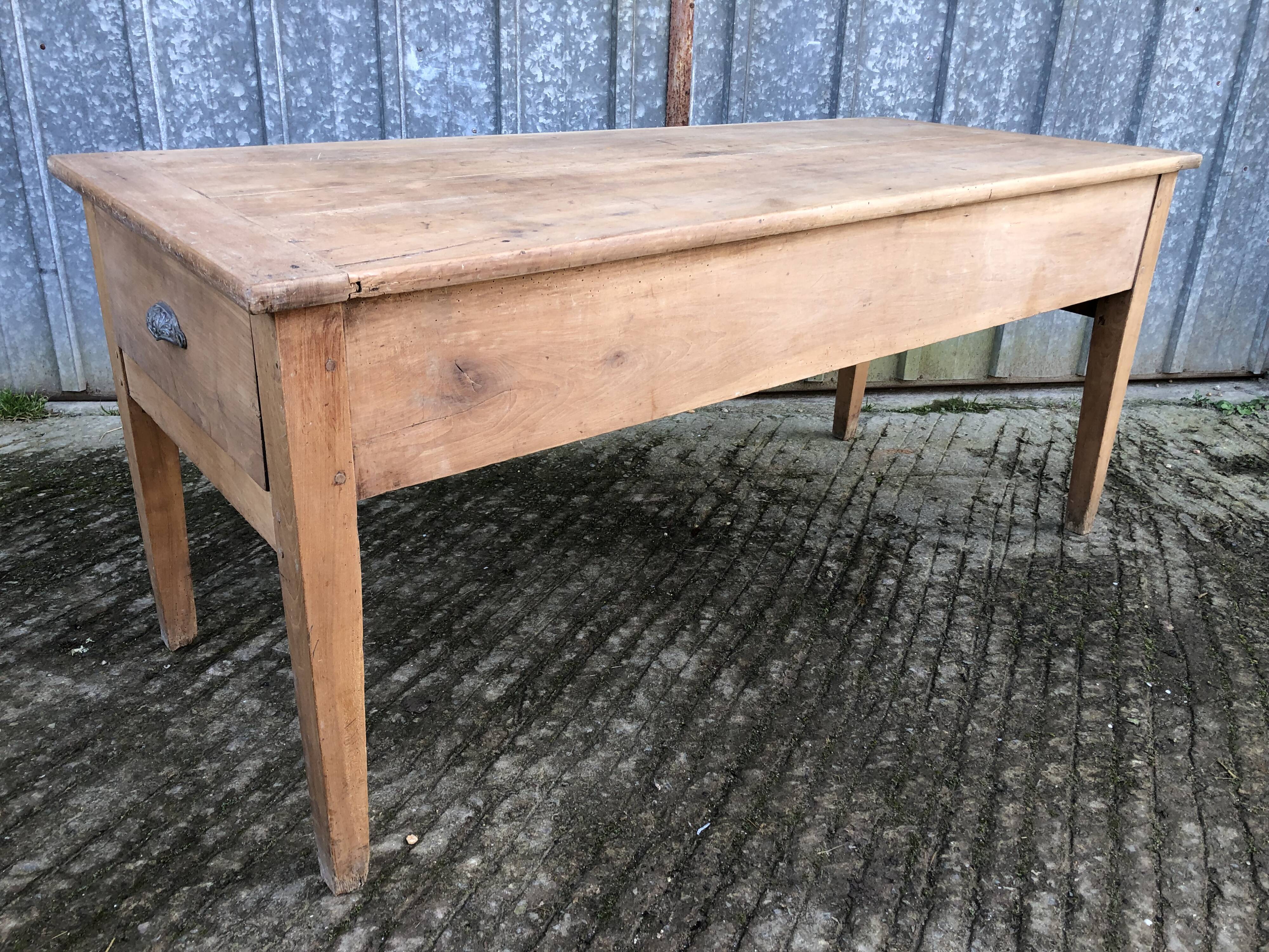 Antique solid cherry farmhouse table with 3 drawers and 1 pull out.