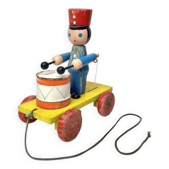 Old wooden musical toy to pull - soldier musician playing the drum