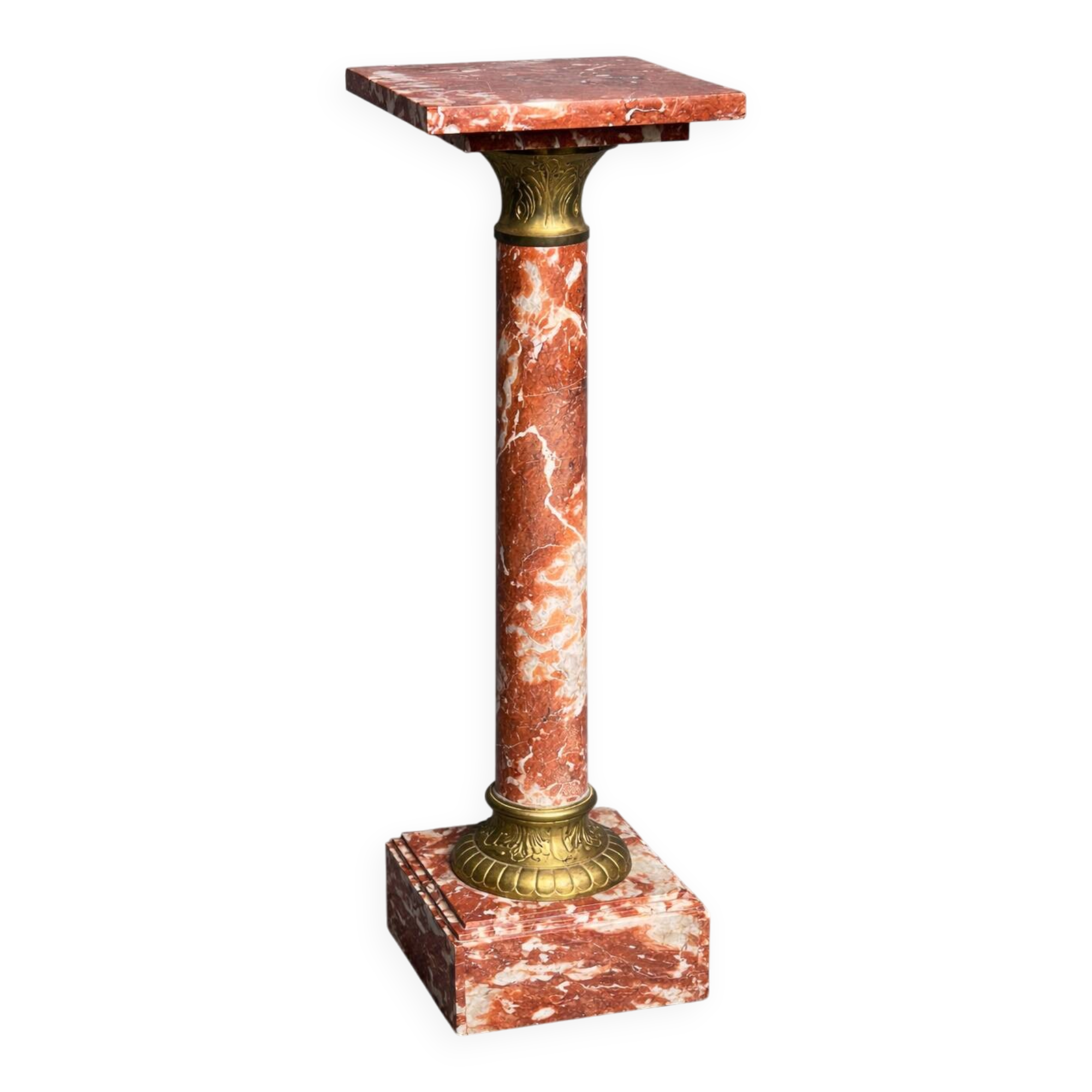Marble pedestal decorated with gilded brass.