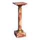 Marble pedestal decorated with gilded brass.