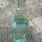 Square bottle of molded-pressed glass with faucet