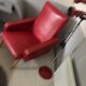Fauteuil en skai rouge et pieds compas vers 1950