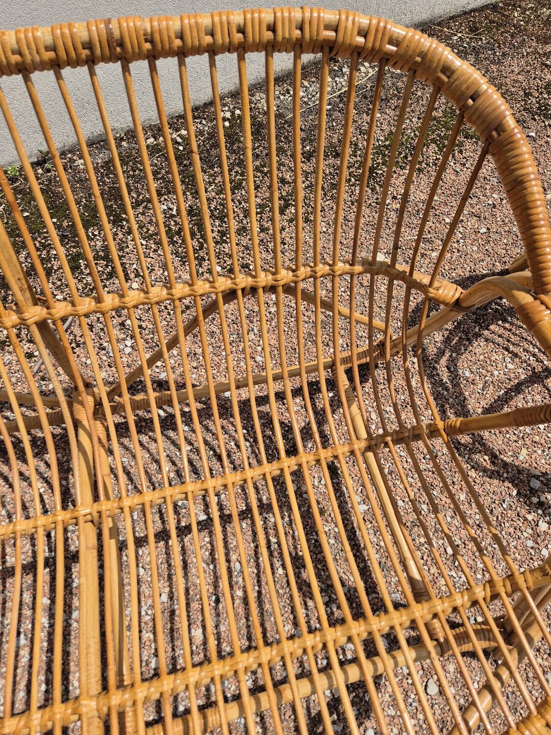 Rattan lounge with two armchairs and a vintage 1950s bench.
