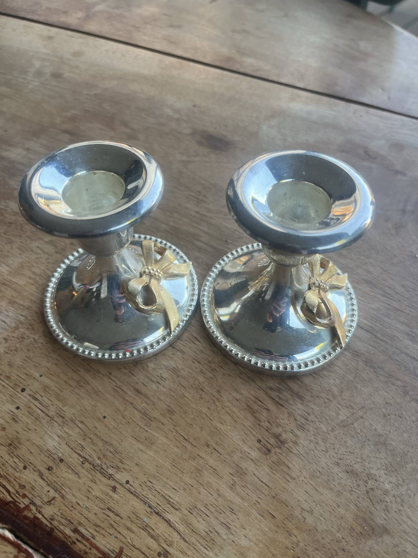 2 silver-plated candlesticks