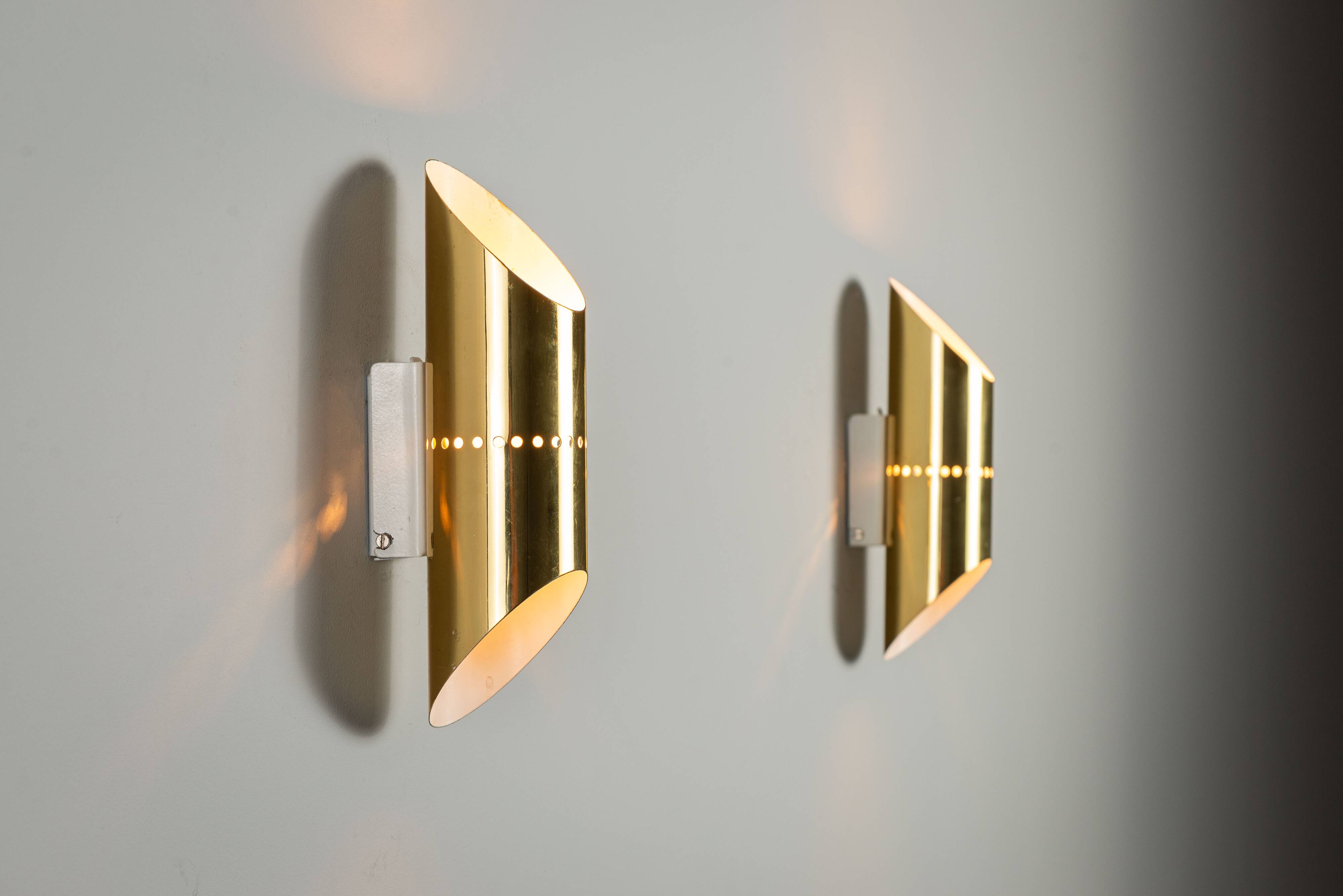 Pair of cylindrical wall lamps in brass with perforated shades
