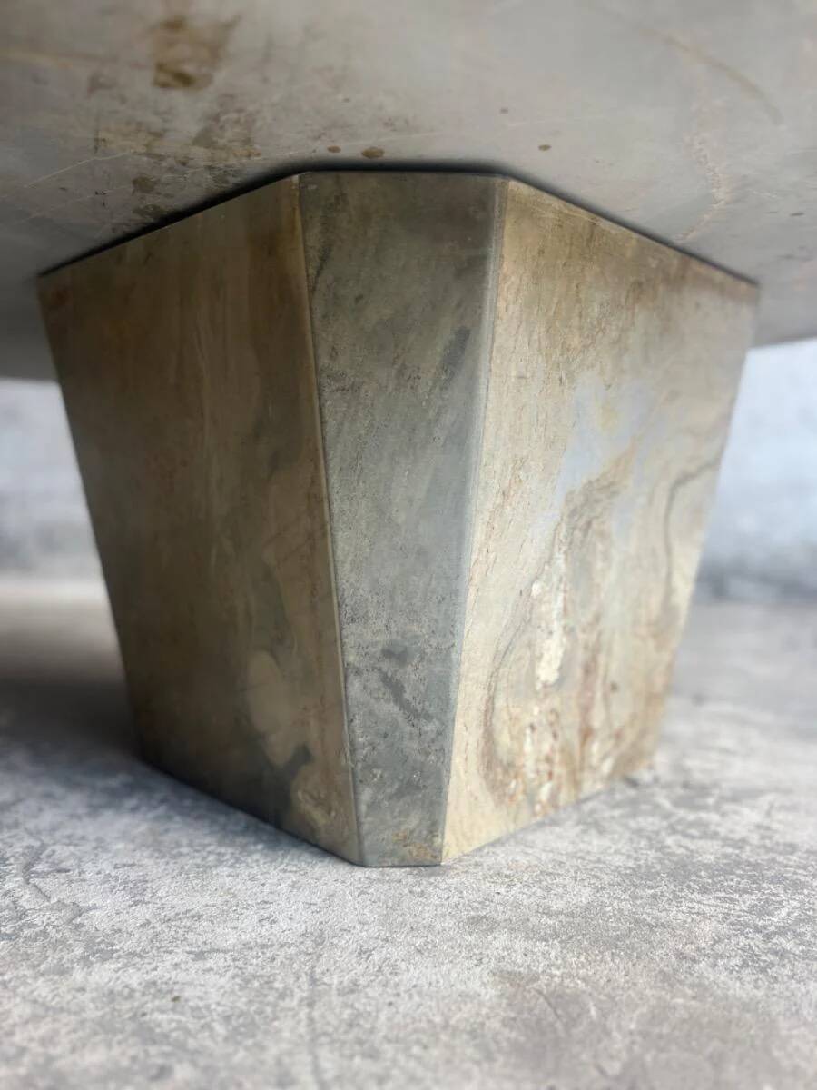 Light gray solid granite coffee table with organic triangular shape and conical base, 1980s