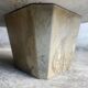 Light gray solid granite coffee table with organic triangular shape and conical base, 1980s