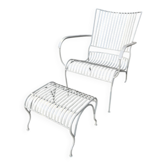 Metal garden chair and its footrest.