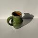 Green glazed ceramic pitcher