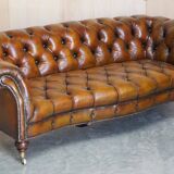 Pair of leather Chesterfield sofas by Howard & Sons