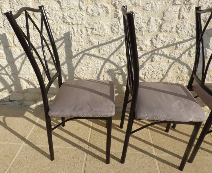 4 black metal chairs with high backs and gray suede tops