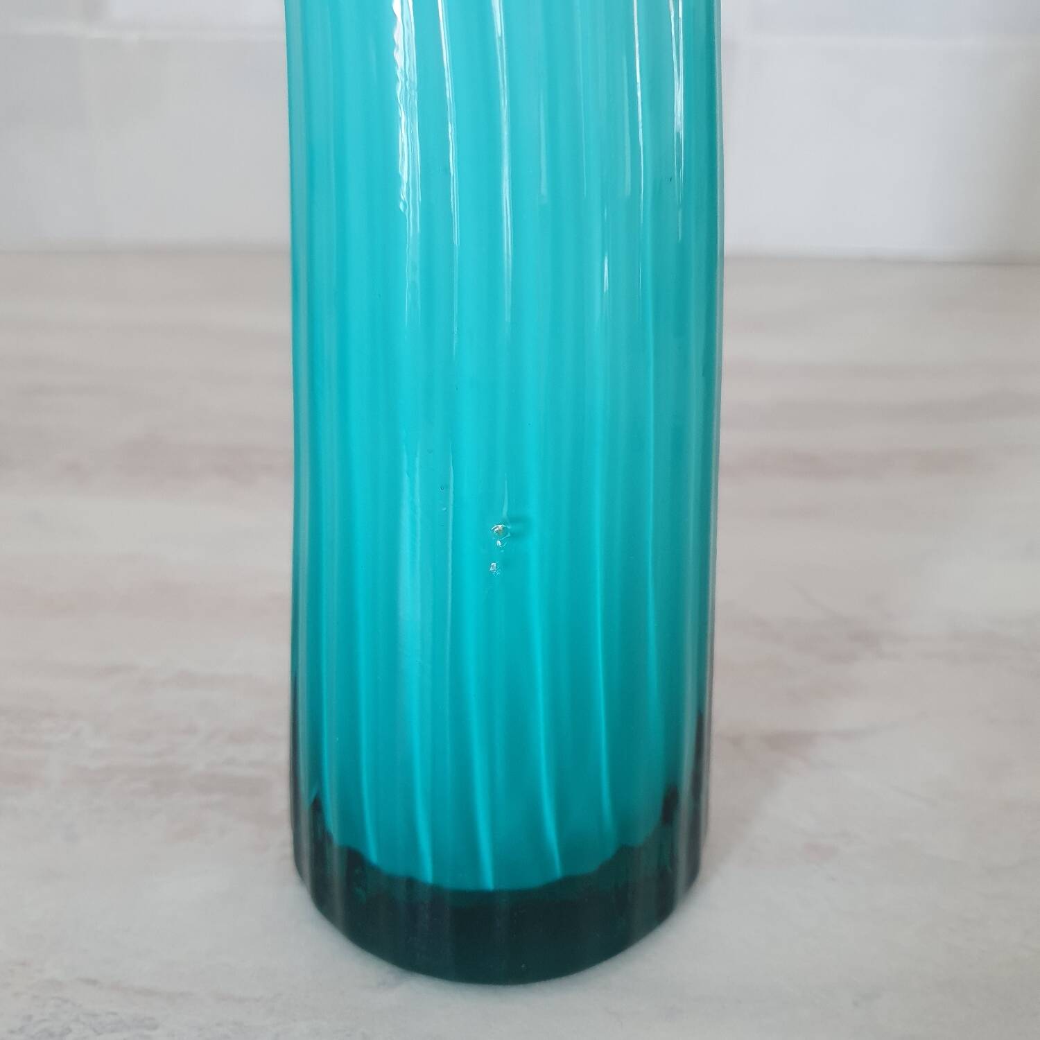 Curved turquoise blue blown glass soliflore vase