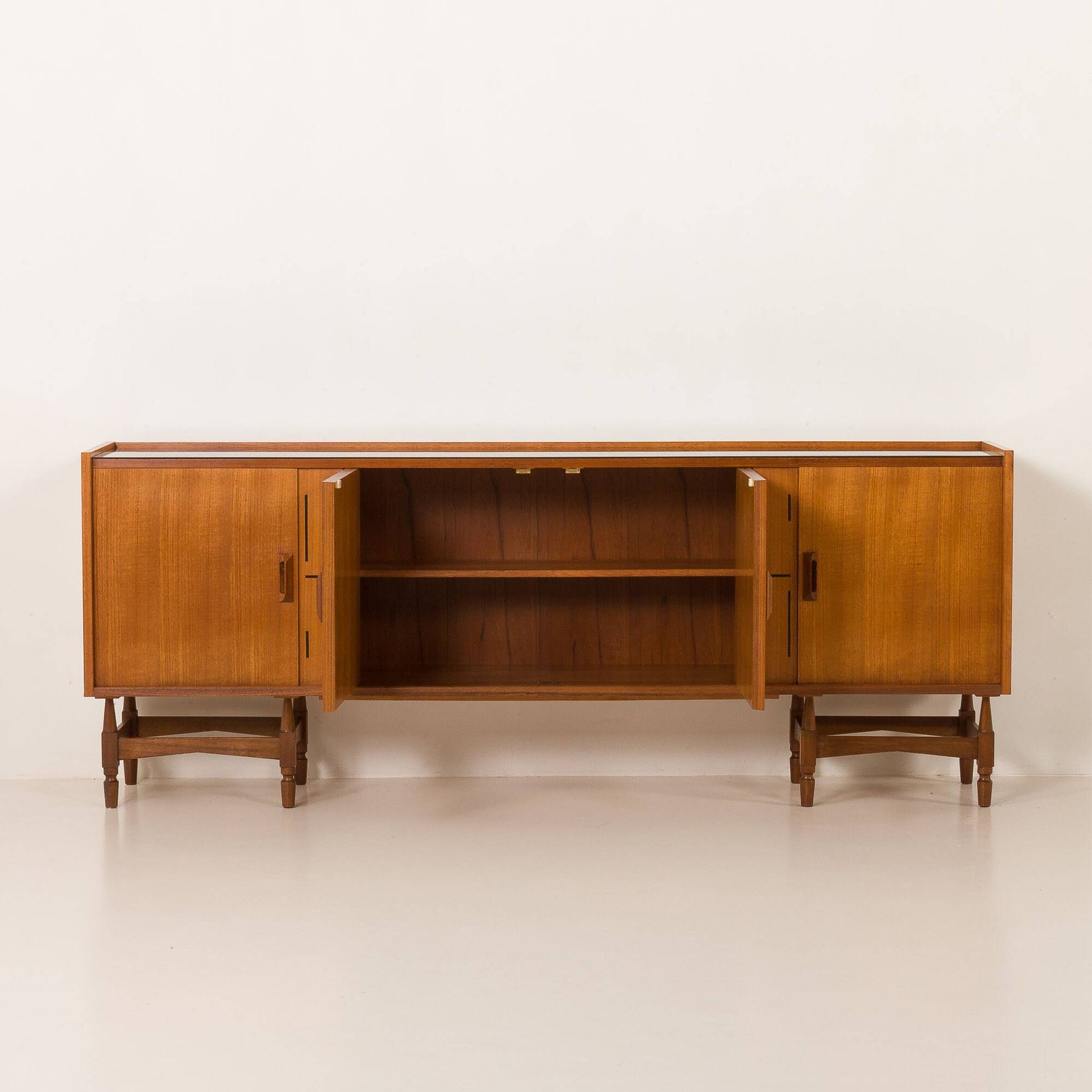 Itaian mid century teak sideboard with black glass top and inlays, 1970s