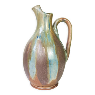 Art Nouveau style carafe in flamed stoneware with blue and brown drips