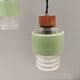 Three-part pendant in crystal glass, teak wood, and thin dusty green metal