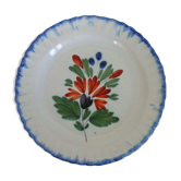 Assiette en faïence à décor floral polychrome XIXème