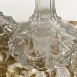 Pair of moulded glass candlesticks, ram heads and masks