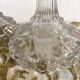 Pair of moulded glass candlesticks, ram heads and masks