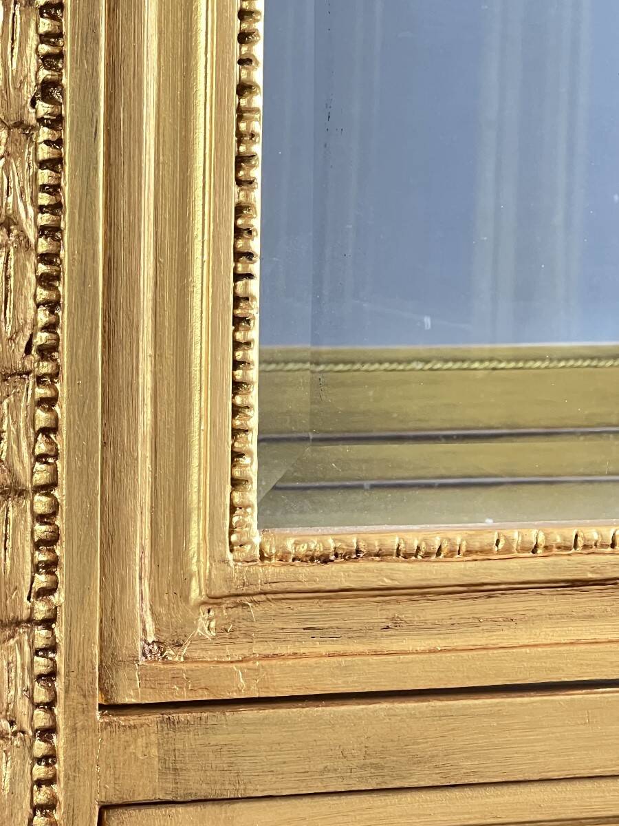 Carved and gilded wooden display cabinet, Louis XVI style, 20th century.