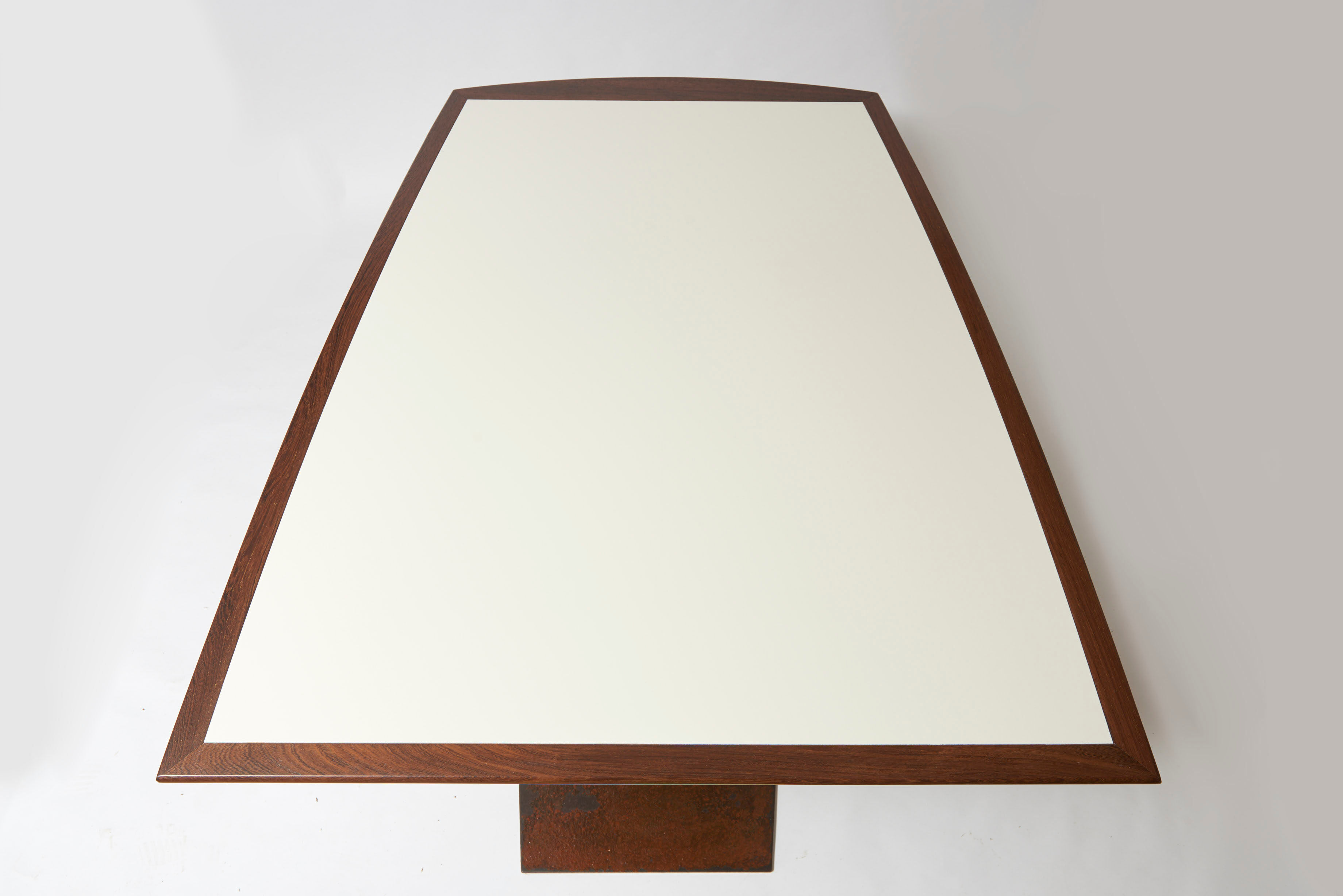 Brutalist conference table made of wood and steel