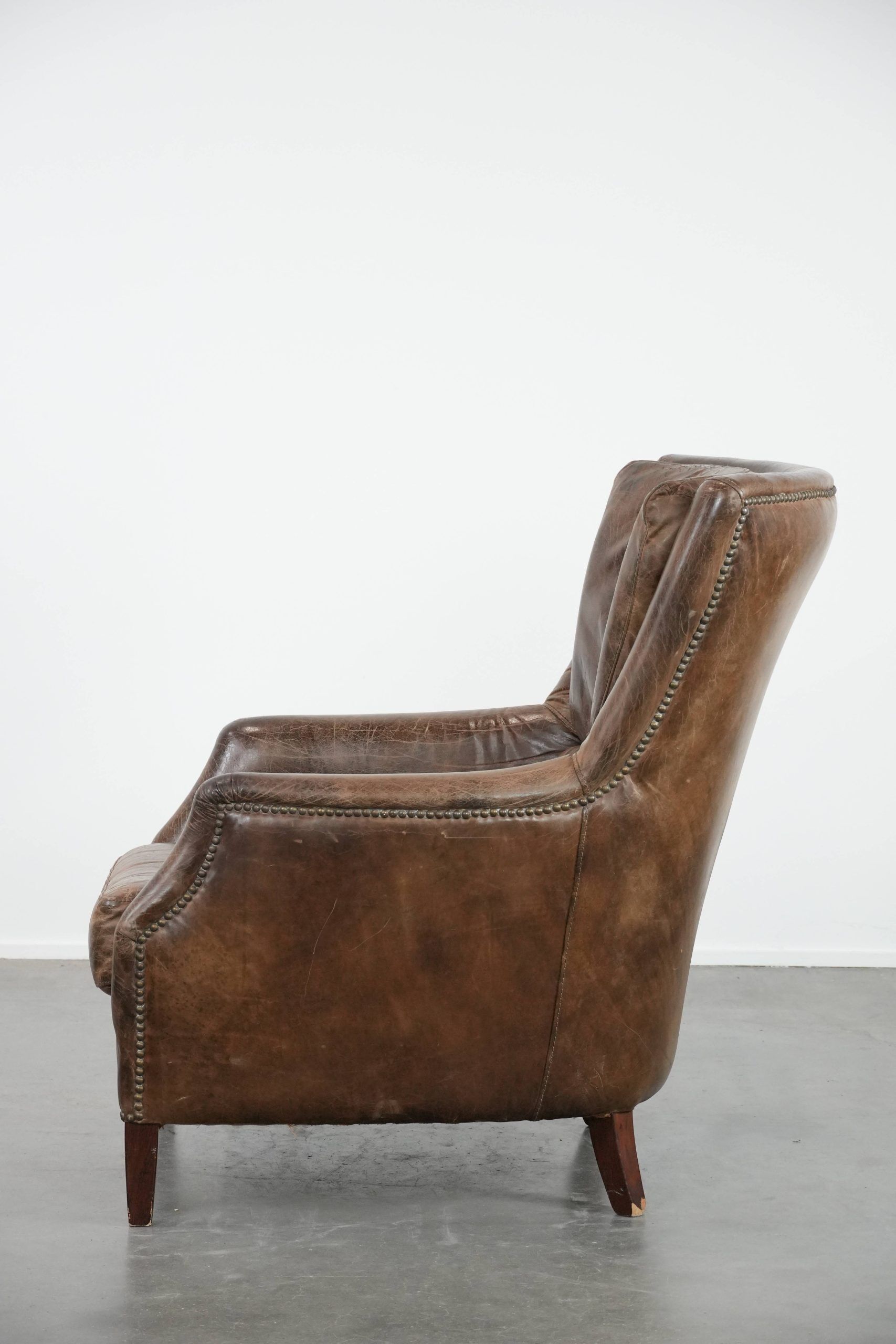 Very comfortable vintage cow leather armchair with beautiful colours